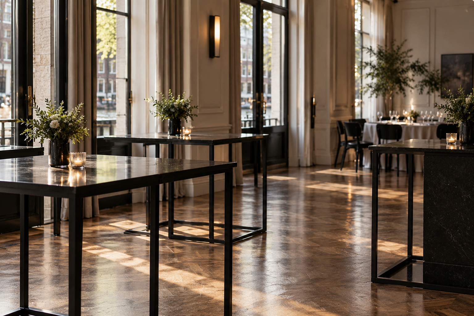 A clean event space with cleared tables after buffet service