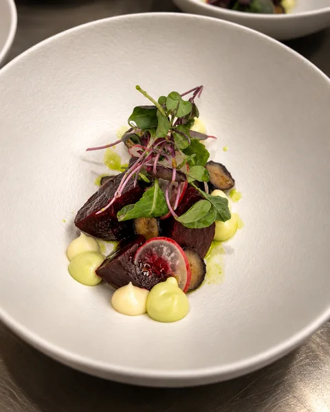 A carefully arranged dish in a white bowl
